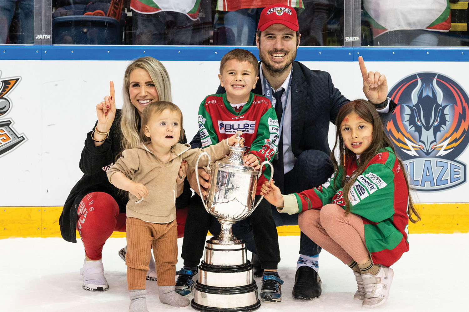 Brodie Dupont with his wife Kayleen and children Zurie, left, Braydie, centre, and Kaydie, right, after his team won the league championship.